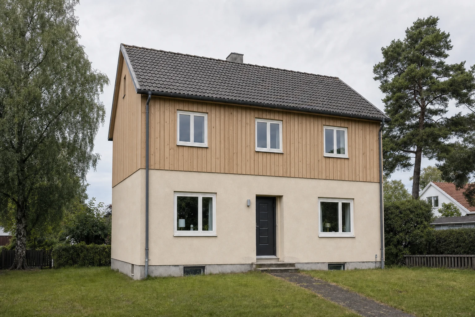 The same house given a Nordic look: vertical timber cladding on the upper floor above cream render, with the dark roof and door unchanged